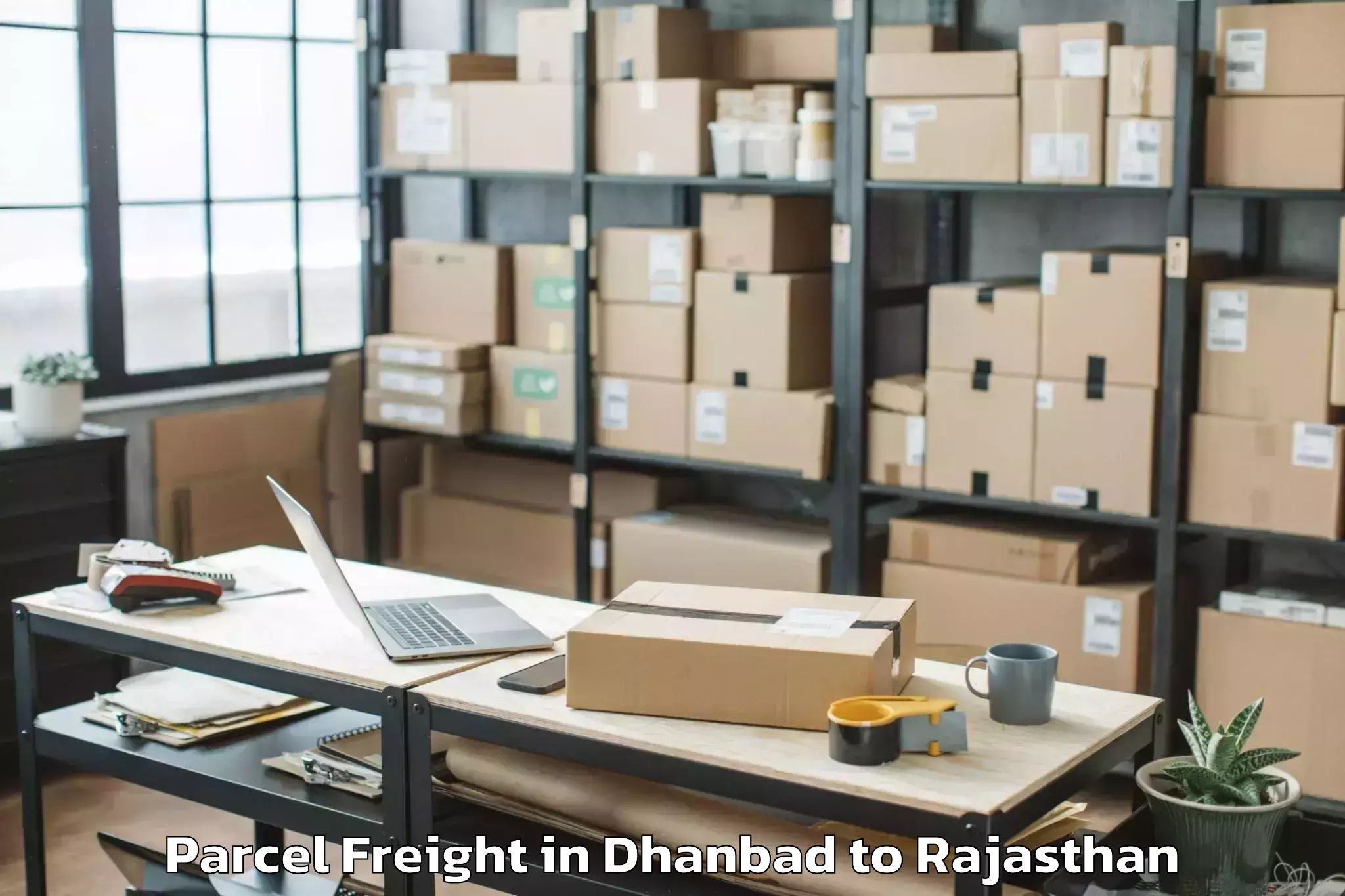 Hassle-Free Dhanbad to Madhav University Pindwara Parcel Freight